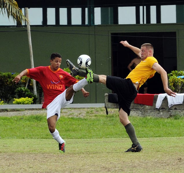 2 players battling for the ball
